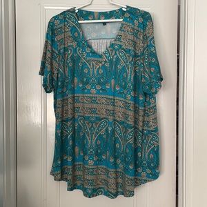 Turquoise and tan short sleeved shirt.